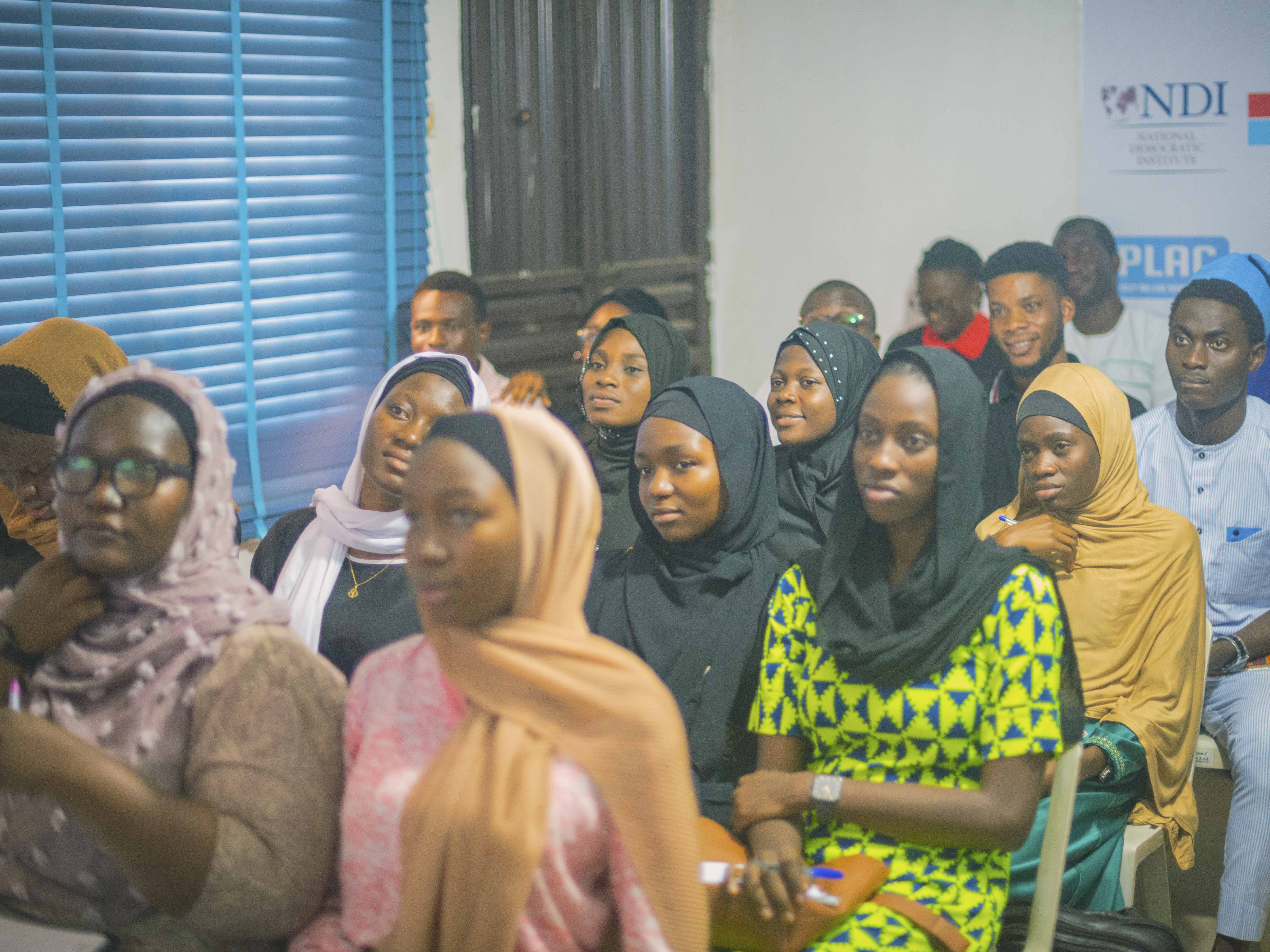 Group of young women taking notes during session